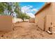 Expansive backyard featuring desert landscaping and a privacy fence, perfect for outdoor entertaining at 706 N Signal Butte Rd, Mesa, AZ 85207