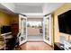 An office space has french doors that lead to a balcony with beautiful outdoor views at 706 N Signal Butte Rd, Mesa, AZ 85207