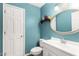 Bathroom with wainscoting, decorative mirror, and white vanity at 706 N Signal Butte Rd, Mesa, AZ 85207