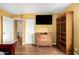 The bright bedroom features hardwood floors and ample space for storage at 706 N Signal Butte Rd, Mesa, AZ 85207