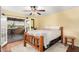 Bedroom featuring bed, ceiling fan, and balcony access at 706 N Signal Butte Rd, Mesa, AZ 85207