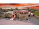 Southwestern home showcasing stylish architecture, red tile roof, and desert landscape at 706 N Signal Butte Rd, Mesa, AZ 85207