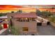 Exterior view of a desert home with a red tile roof and stylish architecture at 706 N Signal Butte Rd, Mesa, AZ 85207