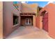 Charming courtyard featuring stucco walls, stylish accents, and gated entry at 706 N Signal Butte Rd, Mesa, AZ 85207