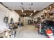 Uncluttered garage space with lighting, overhead storage, and room for multiple vehicles at 706 N Signal Butte Rd, Mesa, AZ 85207