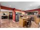 Bright kitchen with an island, stainless appliances, and breakfast bar at 706 N Signal Butte Rd, Mesa, AZ 85207