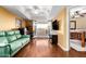 The brightly lit living room opens up to an outdoor balcony and features hardwood floors at 706 N Signal Butte Rd, Mesa, AZ 85207
