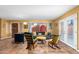 Open living room with modern furnishings, French doors, and view of outdoor space at 706 N Signal Butte Rd, Mesa, AZ 85207