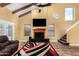 Bright and airy living room with high ceilings, a fireplace, and ample seating at 706 N Signal Butte Rd, Mesa, AZ 85207