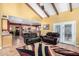 Open living area with access to a kitchen and french doors to the backyard at 706 N Signal Butte Rd, Mesa, AZ 85207