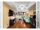 The naturally lit loft features laminate floors, a ceiling fan, and ample space at 706 N Signal Butte Rd, Mesa, AZ 85207