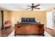 Spacious main bedroom with hardwood flooring and elegant furnishings at 706 N Signal Butte Rd, Mesa, AZ 85207
