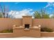 Backyard built-in outdoor grill with storage and prep areas at 706 N Signal Butte Rd, Mesa, AZ 85207