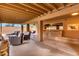 Covered patio with seating area and outdoor kitchen featuring bar and sink at 706 N Signal Butte Rd, Mesa, AZ 85207