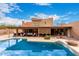 Beautiful pool and back yard with covered patio at 706 N Signal Butte Rd, Mesa, AZ 85207