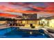 Relaxing outdoor living with a sparkling pool, covered patio, and cozy lounge furniture at 706 N Signal Butte Rd, Mesa, AZ 85207