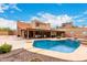 Stunning backyard pool and covered patio, perfect for outdoor entertaining at 706 N Signal Butte Rd, Mesa, AZ 85207