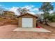 Single-car storage shed with white door at 706 N Signal Butte Rd, Mesa, AZ 85207