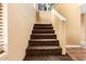 Carpeted staircase with neutral walls leads to the upper level of the home at 706 N Signal Butte Rd, Mesa, AZ 85207