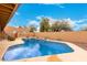 Swimming pool with serene landscaping at 706 N Signal Butte Rd, Mesa, AZ 85207