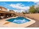 Backyard swimming pool area featuring lounge area and privacy wall at 706 N Signal Butte Rd, Mesa, AZ 85207