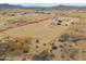 Fenced horse property with outdoor arena and ample space for equestrian activities and livestock at 7209 N Maple St, Maricopa, AZ 85139