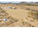 Horse property with large outdoor arena, offering space for training and recreation at 7209 N Maple St, Maricopa, AZ 85139