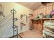 Inside this barn, you'll find metal shelving and convenient saddle racks, optimizing space for equestrian equipment at 7209 N Maple St, Maricopa, AZ 85139