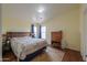 Bright bedroom boasts natural light, a warm color scheme, and ample closet space at 7209 N Maple St, Maricopa, AZ 85139