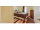 Bright bedroom features warm neutral walls, and laminate wood flooring at 7209 N Maple St, Maricopa, AZ 85139
