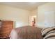 This bedroom showcases natural lighting and a private bathroom at 7209 N Maple St, Maricopa, AZ 85139
