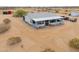 Ranch-style house with a covered porch and desert landscaping, offering a peaceful retreat at 7209 N Maple St, Maricopa, AZ 85139