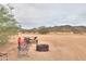 Enjoy the vast desert views from the picnic area with a fire pit, ideal for outdoor gatherings and relaxation at 7209 N Maple St, Maricopa, AZ 85139