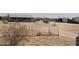 Wide lot with secure fencing, desert landscape, and potential for customization at 7209 N Maple St, Maricopa, AZ 85139