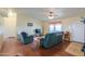 Inviting living room with comfortable seating, ceiling fan and natural light at 7209 N Maple St, Maricopa, AZ 85139