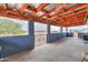 Covered patio with partial walls and decorative metal fence, views of the desert landscape at 7209 N Maple St, Maricopa, AZ 85139