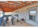 Covered patio with partial walls with electric bicycles, outdoor seating, views of desert landscape at 7209 N Maple St, Maricopa, AZ 85139