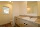 Bright bathroom featuring modern sink, wood-look vinyl floors, and window at 7836 E Javelina Ave, Mesa, AZ 85209