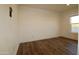 Neutral bedroom with natural light, vinyl plank flooring, and electrical outlets at 7836 E Javelina Ave, Mesa, AZ 85209
