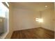 Cozy bedroom features luxury flooring and a large window to bring the outdoors inside at 7836 E Javelina Ave, Mesa, AZ 85209