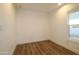 Neutral bedroom features luxury flooring and a large window for natural lighting at 7836 E Javelina Ave, Mesa, AZ 85209