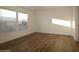 A bedroom with large windows and plenty of natural light showcases a calm and relaxing space at 7836 E Javelina Ave, Mesa, AZ 85209