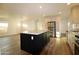 Spacious open-concept kitchen and living area featuring a central island, stainless appliances and luxury flooring at 7836 E Javelina Ave, Mesa, AZ 85209