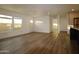 Bright living room featuring luxury flooring and a large window to bring the outdoors inside at 7836 E Javelina Ave, Mesa, AZ 85209