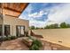 Backyard with stone fountain, patio, desert landscaping and exterior home view at 8307 E Gary Rd, Scottsdale, AZ 85260