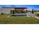 Luxurious backyard featuring a sparkling pool, modern lounge chairs, and views of the sleek, contemporary home at 8307 E Gary Rd, Scottsdale, AZ 85260