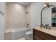 Bright bathroom featuring tub shower combo, sleek fixtures, and tile flooring at 8307 E Gary Rd, Scottsdale, AZ 85260