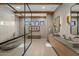 Modern bathroom with a freestanding tub, dual vanities, and stone tile floor at 8307 E Gary Rd, Scottsdale, AZ 85260