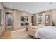Inviting bedroom with a fireplace, television, comfortable furniture and warm decor at 8307 E Gary Rd, Scottsdale, AZ 85260