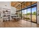 Bright dining room with a wood ceiling, floor-to-ceiling windows, and modern furnishings at 8307 E Gary Rd, Scottsdale, AZ 85260